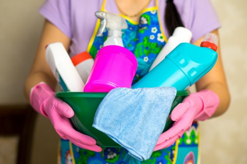 Carpet cleaning technician preparing equipment safely before work begins
